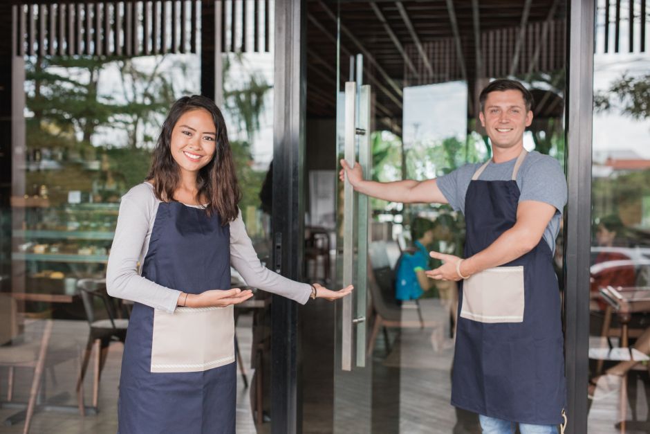 Employees opening door to store